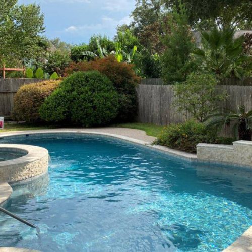 Image of a clean swimming pool with pool service in Katy